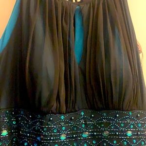 Gentle used black overlay over teal evening gown